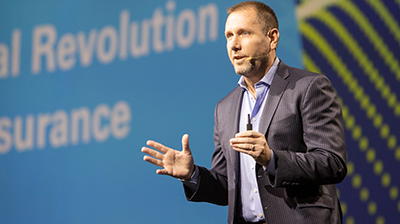 Taylor Rhodes speaking at a conference 