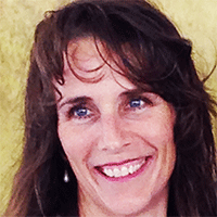 Headshot of a dark haired businesswoman smiling