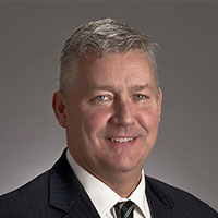Headshot of a businessman smiling