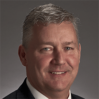 Headshot of a businessman smiling