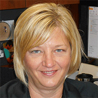 Headshot of a blonde businesswoman smiling