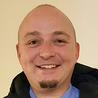 Headshot of a businessman smiling