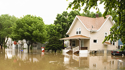 Suburban street flooded after a natural disaster.