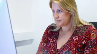 A businesswoman working at her desktop