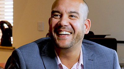 A businessman looking up and smiling