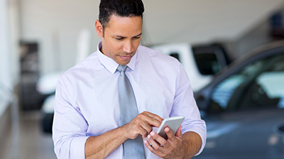 A businessman working on his smart phone