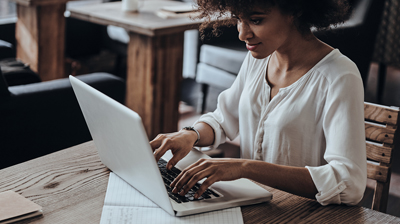 A young woman working on a laptop