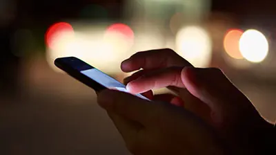 Hands using a cellphone