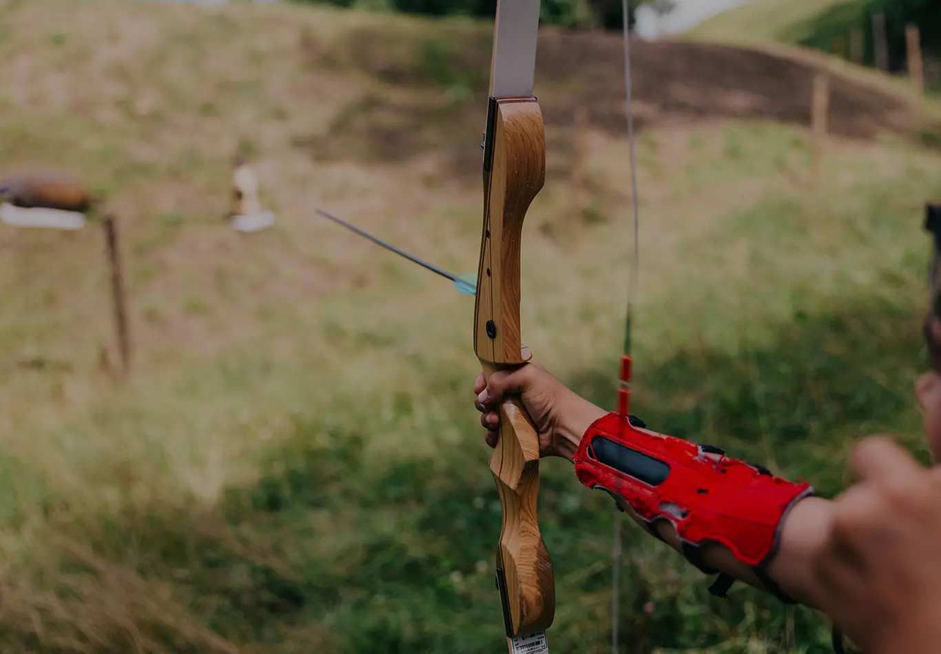 An archer is firing a bow