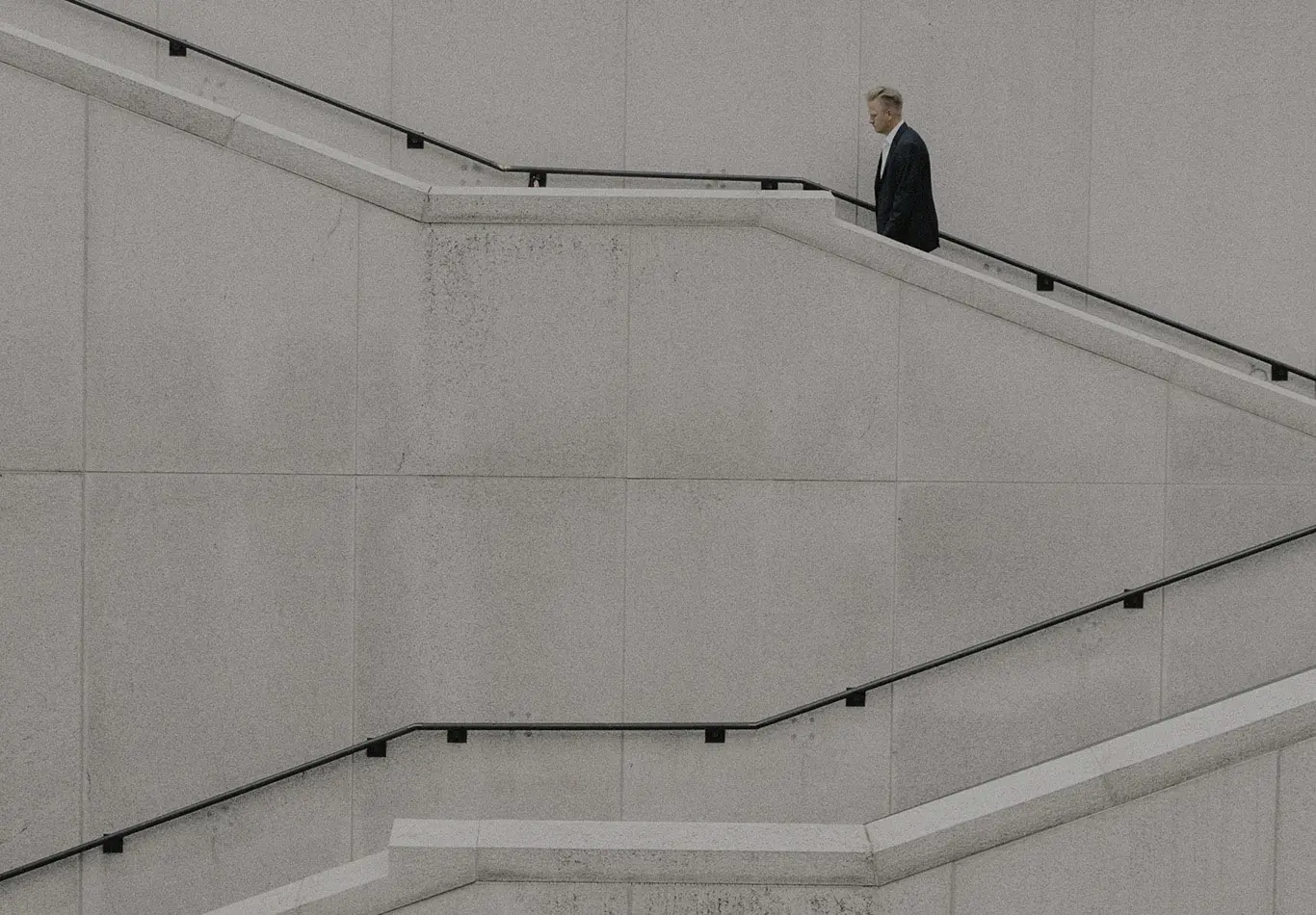 A man is walking up stairs