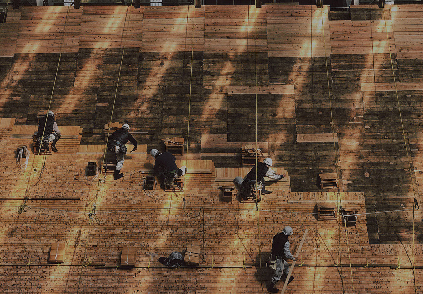 Construction workers working on a wall