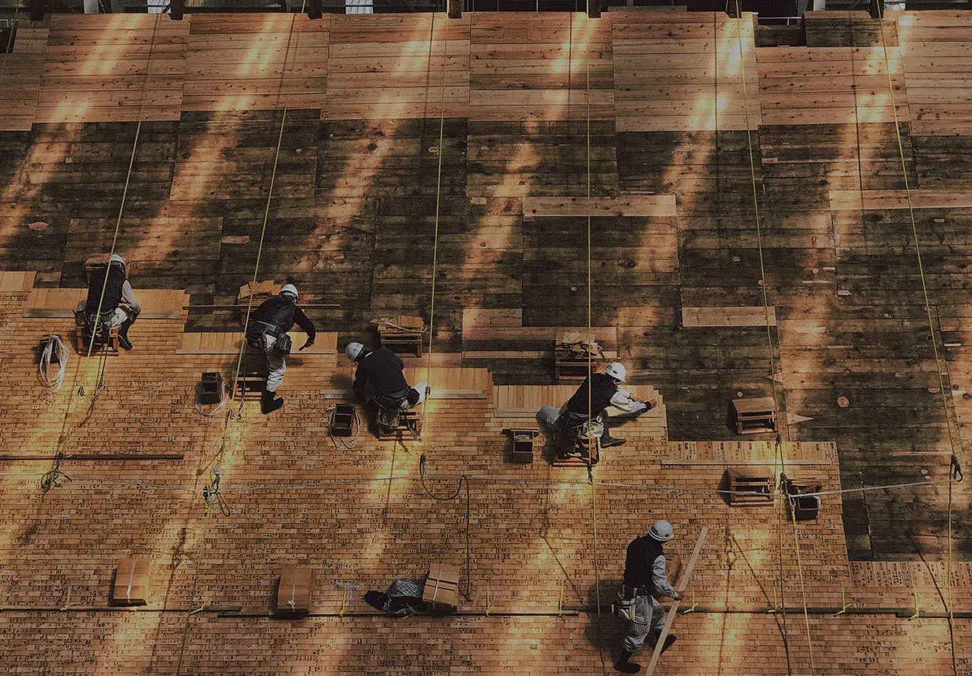 Construction workers working on a wall
