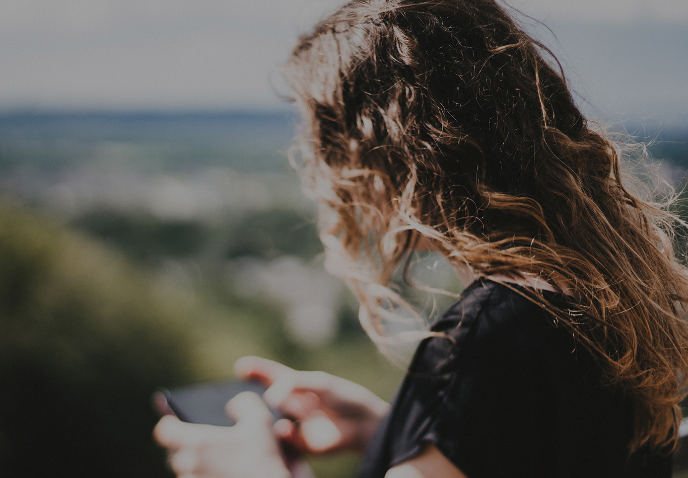 A person is looking at their phone. 