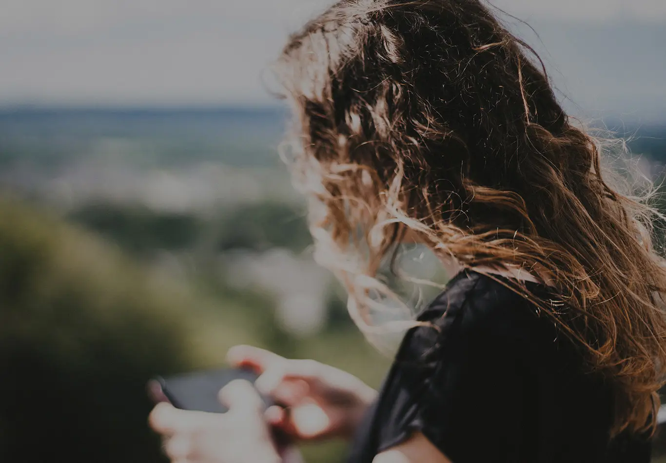 A person is looking at their phone. 